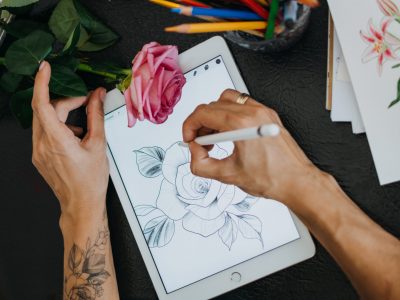 Tattoo art digital process on ipad. Tattoo artist working with Apple Pencil and drawing on iPad Pro in Procreate. Kropivnitskiy, Ukraine, September 27, 2019.