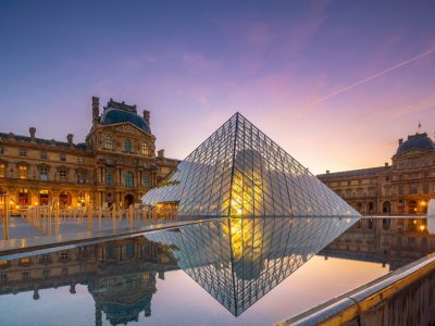 PARIS, FRANCE - SEPTEMBER 15, 2018 : The Louvre Museum and Louvre Pyramid in Paris, France at sunrise